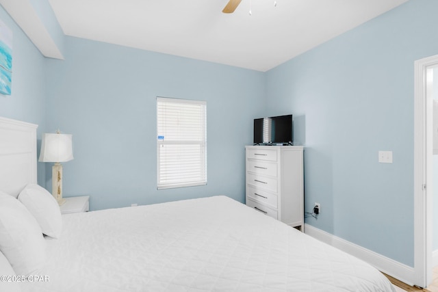 bedroom featuring ceiling fan and baseboards