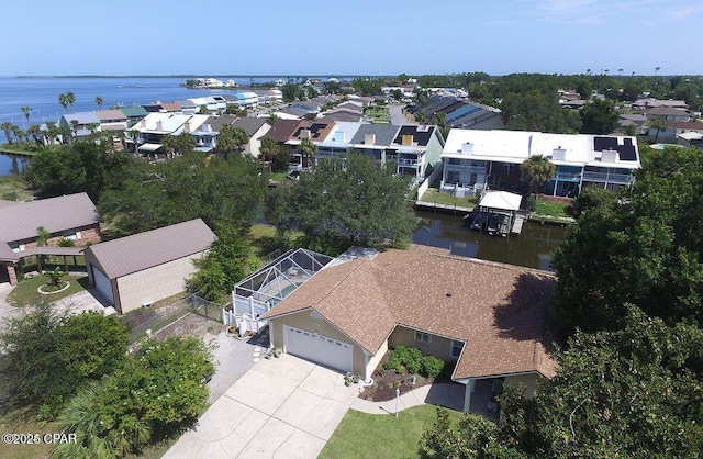 aerial view featuring a residential view and a water view