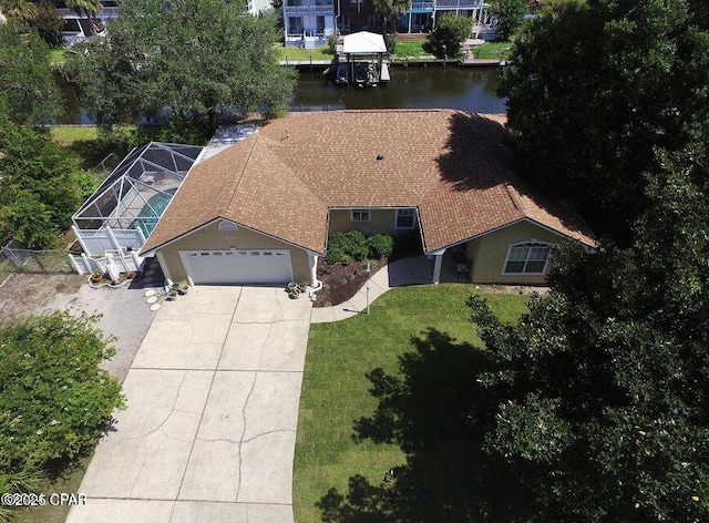 birds eye view of property featuring a water view