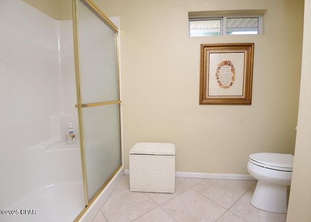 full bathroom with tile patterned floors, a shower stall, toilet, and baseboards