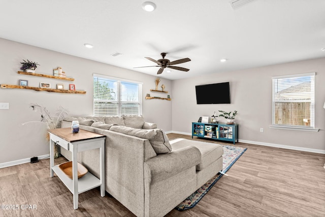 living area featuring visible vents, wood finished floors, recessed lighting, baseboards, and ceiling fan