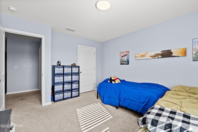 carpeted bedroom featuring visible vents and baseboards