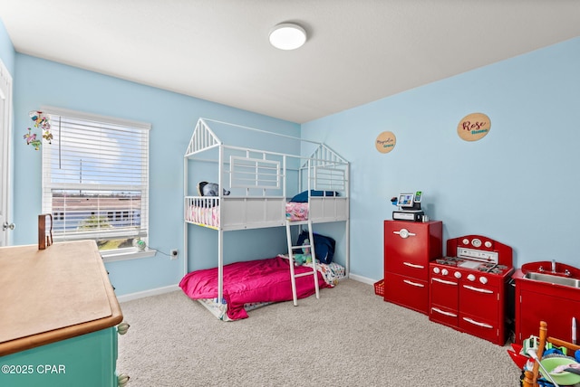 bedroom with carpet flooring and baseboards