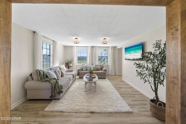 living area featuring wood finished floors and baseboards