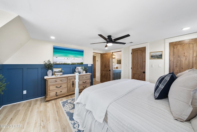 bedroom featuring recessed lighting, two closets, light wood-style flooring, and a ceiling fan