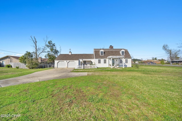 colonial inspired home featuring a front lawn, fence, concrete driveway, a chimney, and a garage