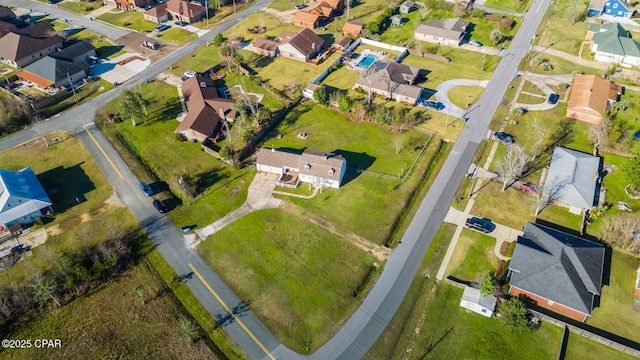 birds eye view of property with a residential view