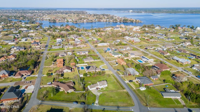 bird's eye view featuring a water view and a residential view