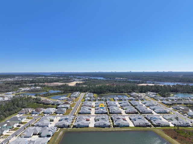 birds eye view of property featuring a residential view and a water view