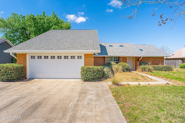 single story home with a garage, brick siding, driveway, and a shingled roof