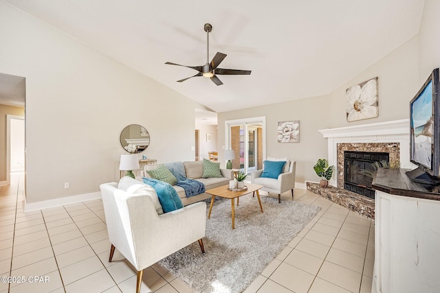 living area with high vaulted ceiling, light tile patterned flooring, a fireplace, baseboards, and ceiling fan