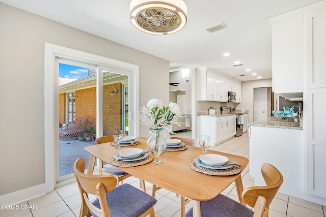 dining room featuring light tile patterned floors, recessed lighting, visible vents, and baseboards