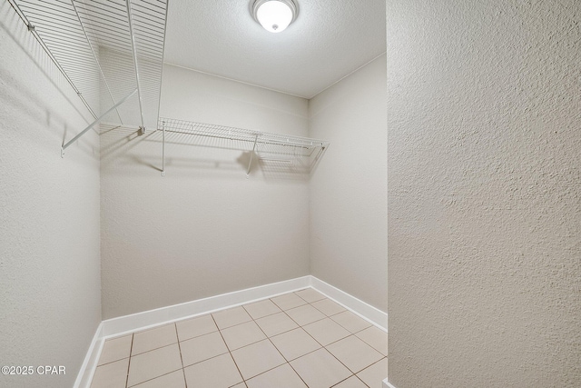 walk in closet featuring light tile patterned floors