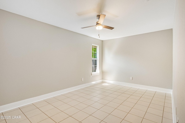 empty room with baseboards and ceiling fan