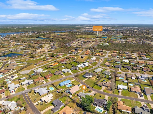 bird's eye view with a residential view and a water view