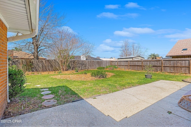 view of yard with a fenced backyard and a patio area