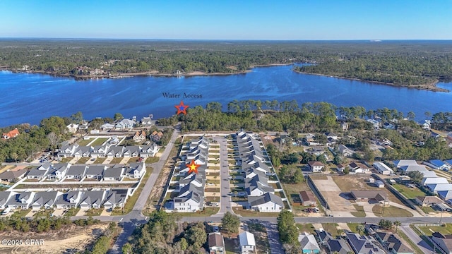 aerial view with a residential view, a forest view, and a water view