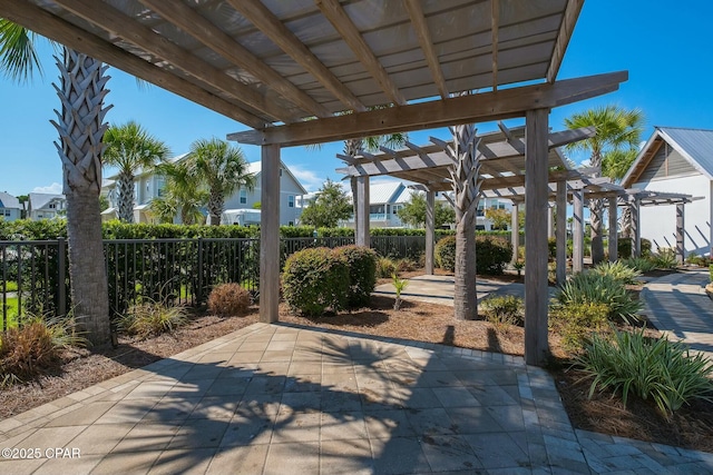 view of patio / terrace featuring fence and a pergola
