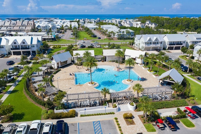 aerial view featuring a residential view and a water view