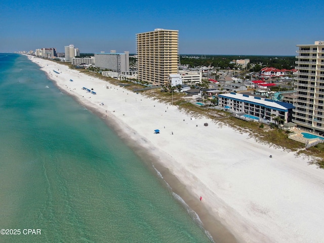 aerial view with a water view, a city view, and a beach view