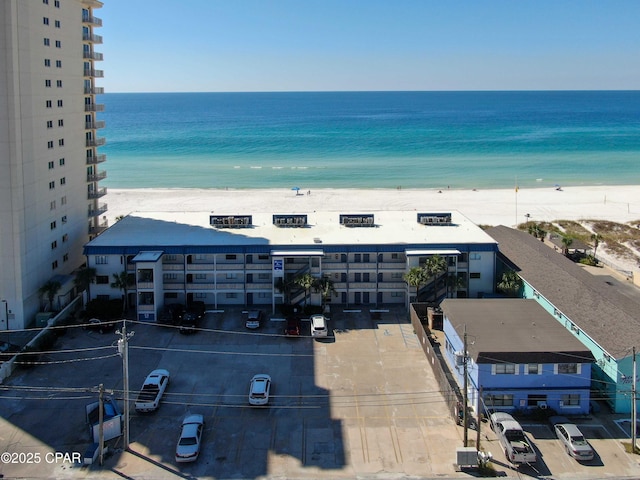 bird's eye view featuring a water view and a view of the beach