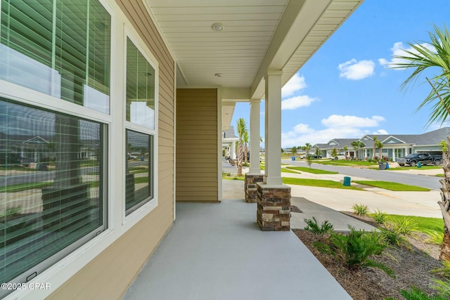 view of patio / terrace featuring a residential view and covered porch