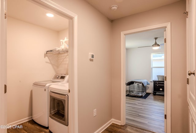 washroom with laundry area, dark wood-style floors, and baseboards