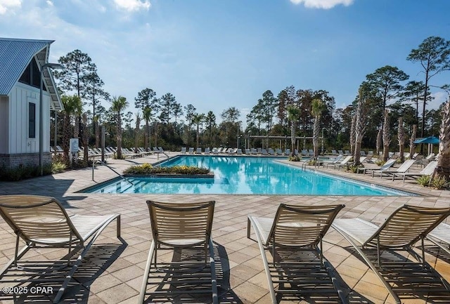 community pool featuring a patio area