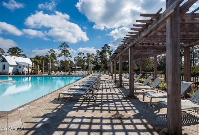 pool featuring a patio and a pergola