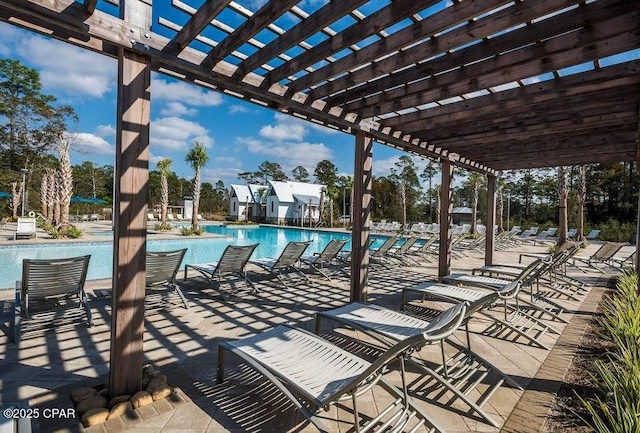 view of patio featuring a pergola and a community pool