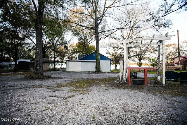 view of yard featuring an outbuilding and a pole building