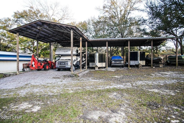 view of vehicle parking featuring a carport