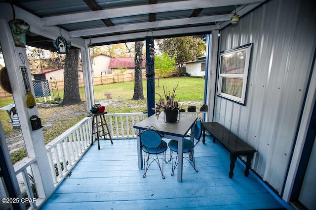 wooden terrace featuring a yard and a fenced backyard