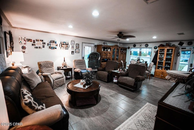 living room with ornamental molding, recessed lighting, and ceiling fan