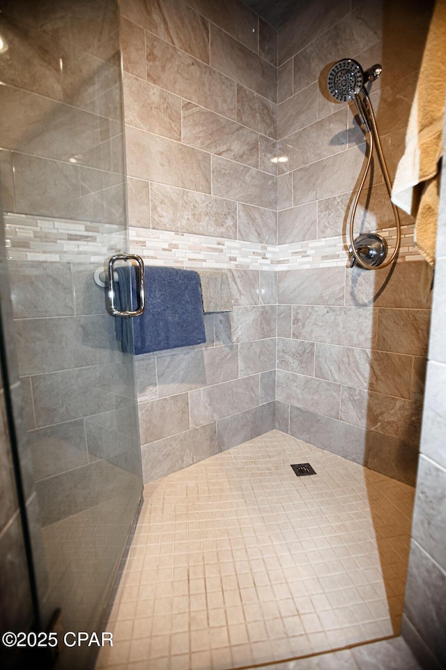 full bath featuring a shower stall