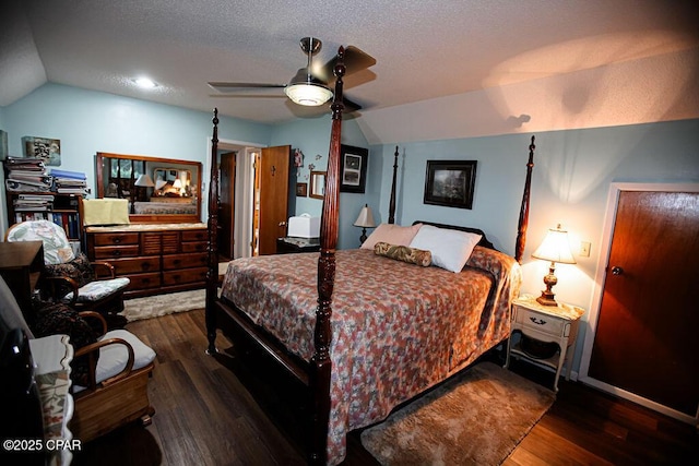 bedroom with a textured ceiling, lofted ceiling, and wood finished floors