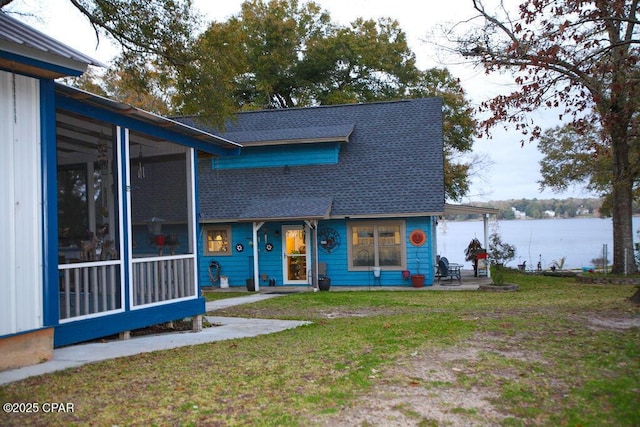 view of front of home featuring a patio and a front lawn