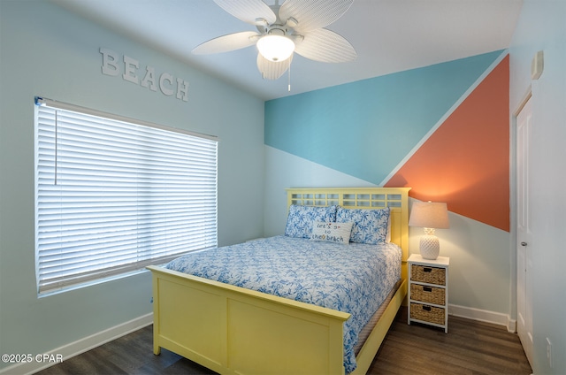 bedroom with dark wood-type flooring, a ceiling fan, and baseboards