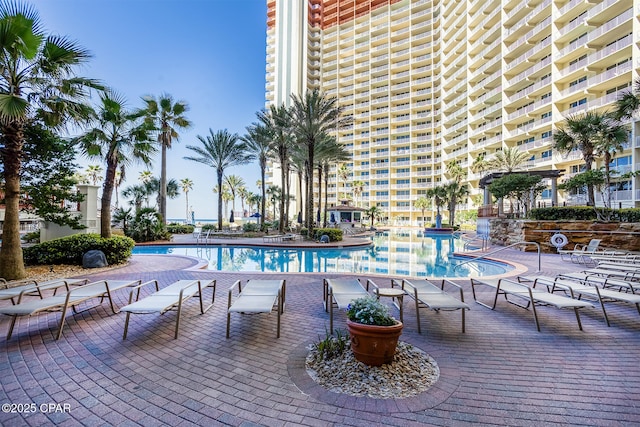 community pool with a patio area