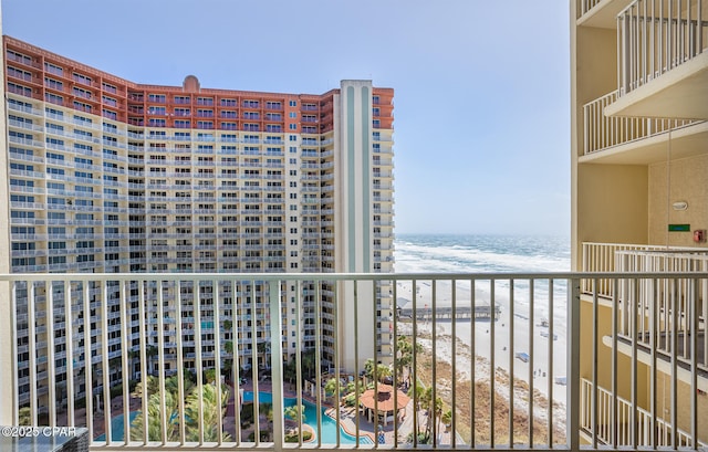 balcony with a view of the beach and a water view