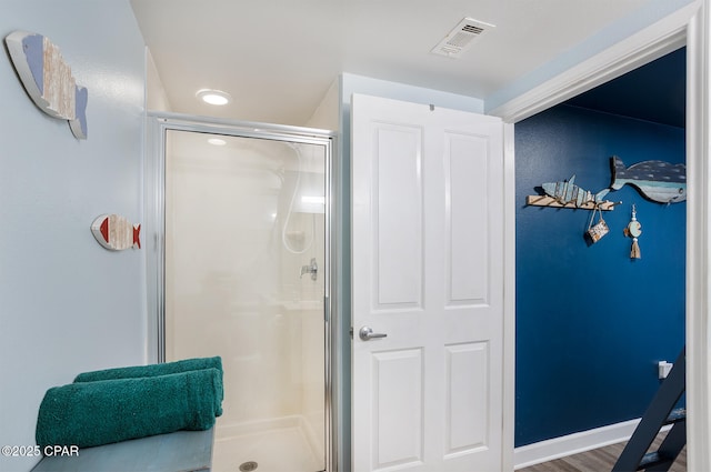 full bath featuring visible vents, baseboards, and a stall shower