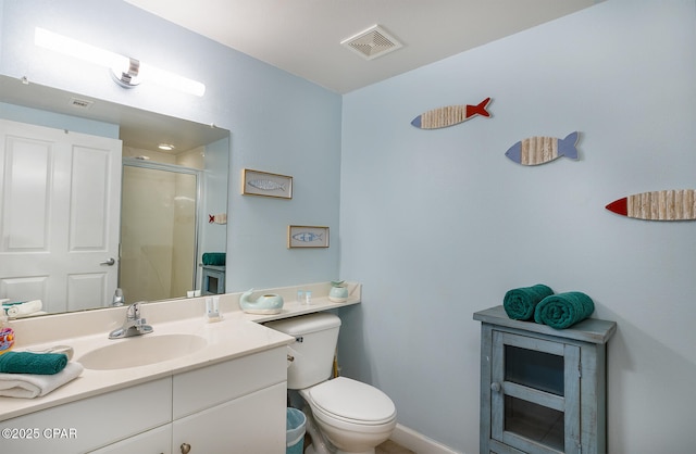 bathroom featuring visible vents, vanity, toilet, and a shower stall