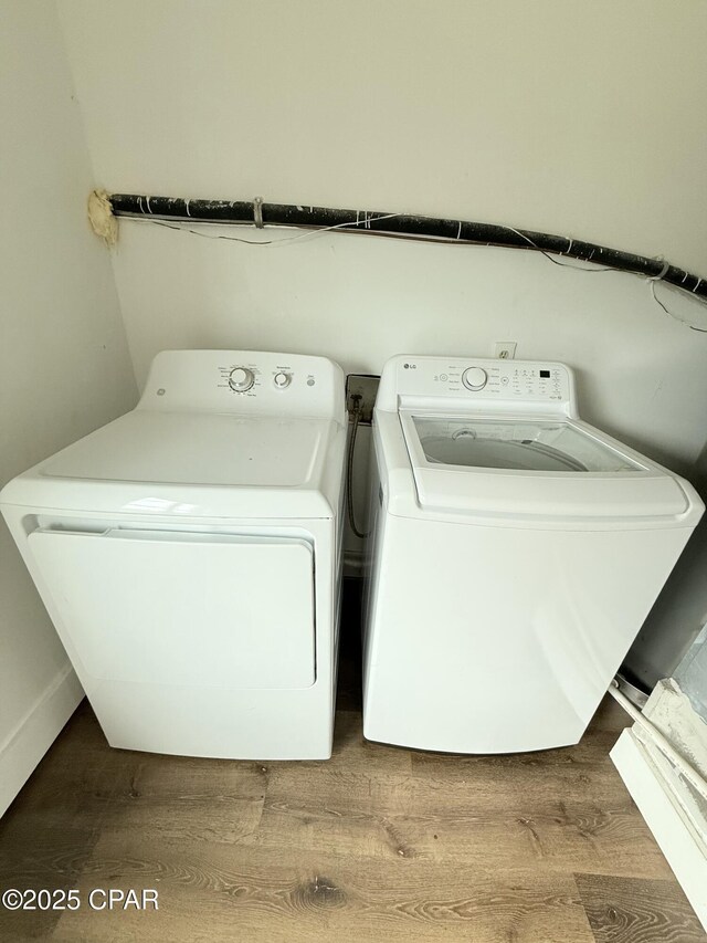 816 N E, Panama City, FL 32401 - laundry area featuring wood finished floors, separate washer and dryer, and laundry area