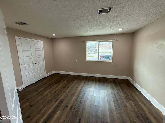 816 N E, Panama City, FL 32401 - unfurnished room with dark wood-type flooring, baseboards, and visible vents