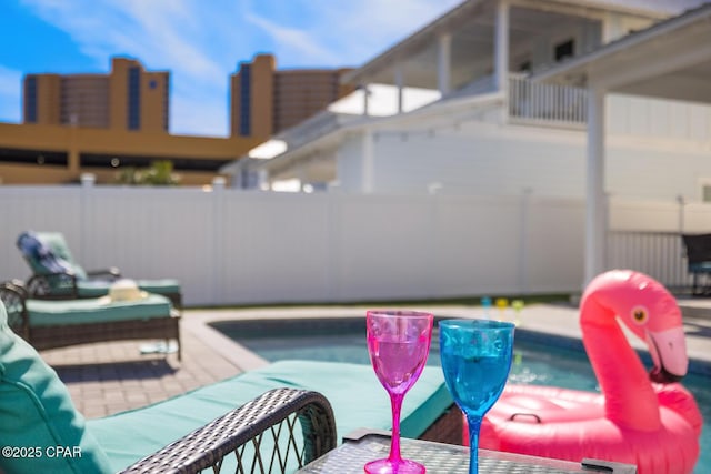 view of patio / terrace featuring fence