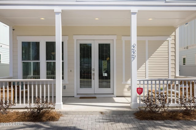 property entrance with french doors and covered porch