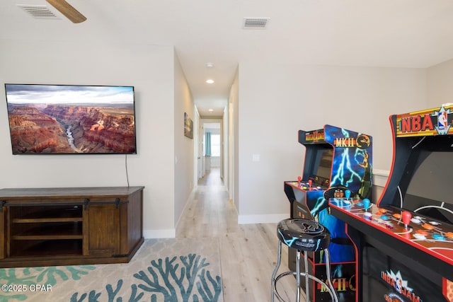 interior space with recessed lighting, wood finished floors, visible vents, and baseboards