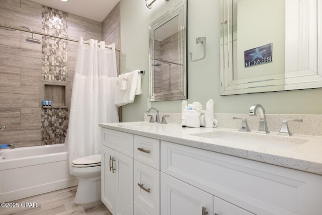 227 Sands St, Panama City Beach, FL 32413 - full bathroom with double vanity, shower / bath combo with shower curtain, and wood finished floors