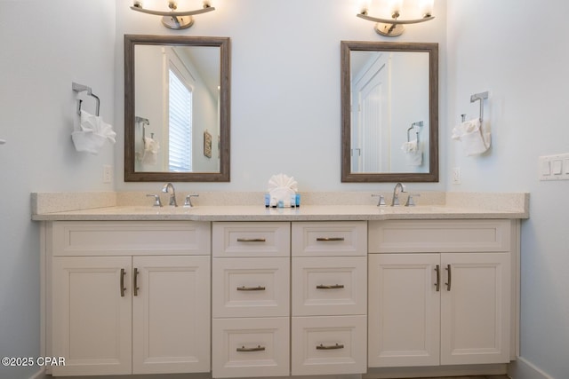 bathroom featuring double vanity and a sink