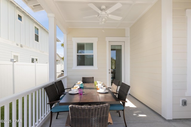 exterior space with a ceiling fan and fence